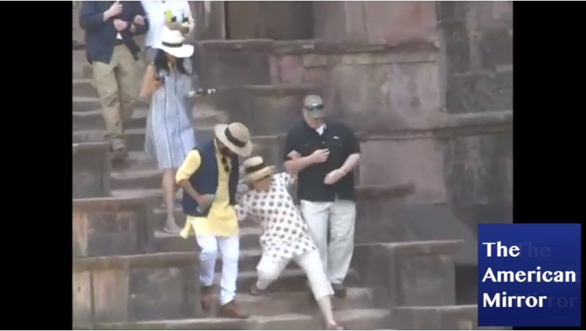 VIDEO: Hillary slips down stairs in India - despite two men holding her up - The American Mirror