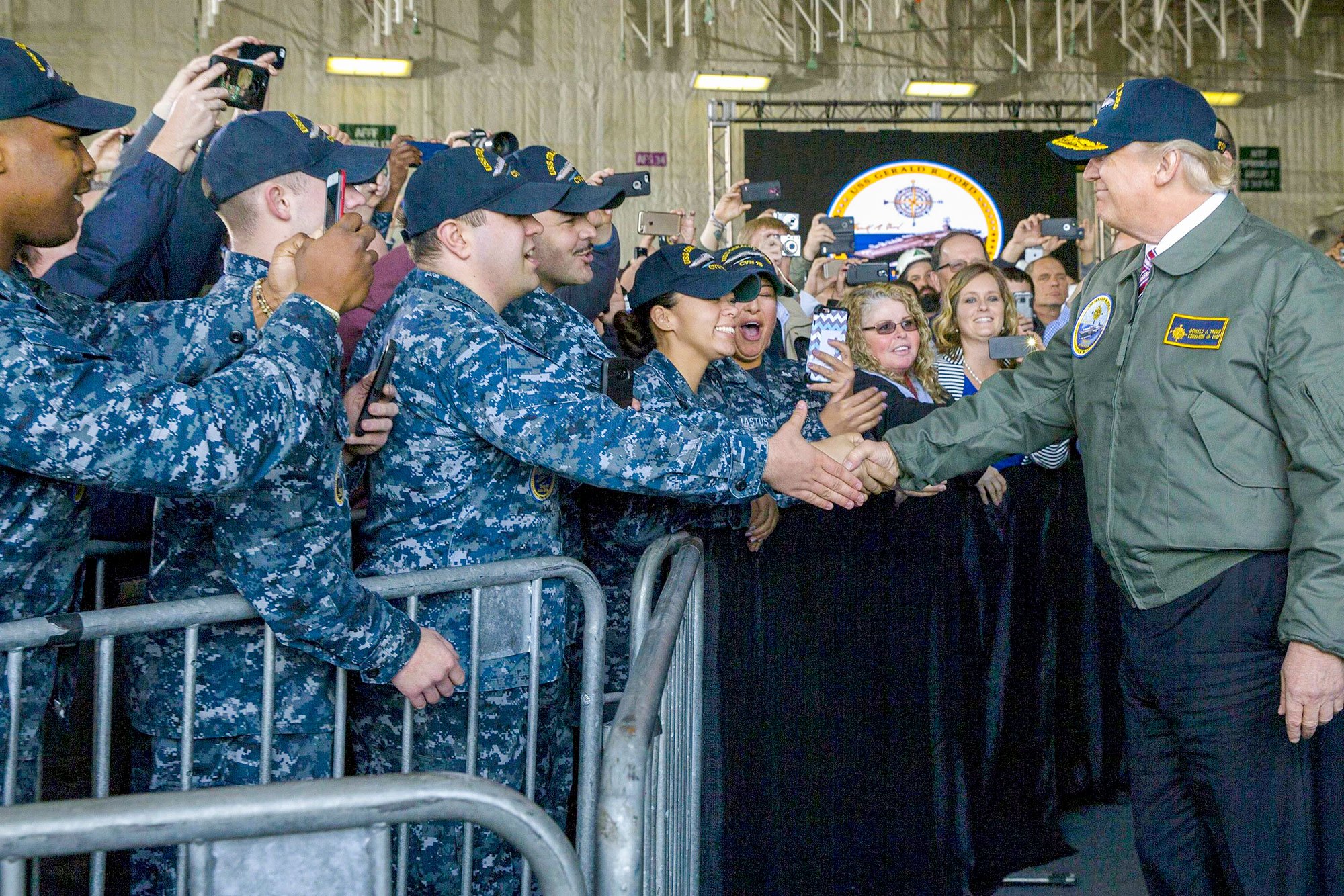 President Donald J. Trump greets sailors after entering the hangar bay aboard the future USS Gerald R. Ford in Newport News, Va., Mar. 2, 2017. Trump met with sailors and shipbuilders of the Navy’s newest aircraft carrier.